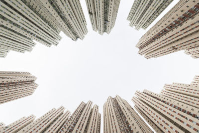 Buildings in row under sky