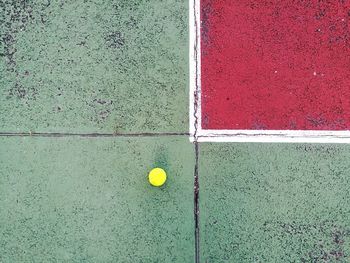 Directly above view of yellow ball on playing field