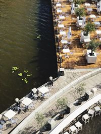 High angle view of buildings by lake in city