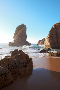 Scenic view of sea against clear blue sky