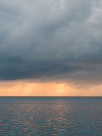 Scenic view of seascape against sky during sunset
