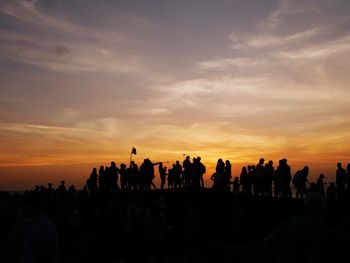 Silhouette people at sunset