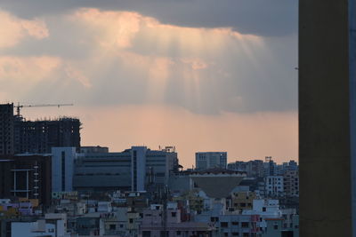 High angle view of buildings against sky at sunset