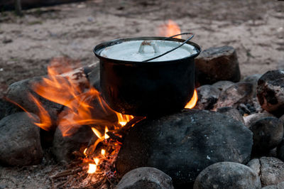 Close-up of a kettle on an outdoor fire pit