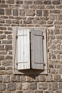 Low angle view of window on old building