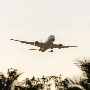 Low angle view of airplane flying against clear sky