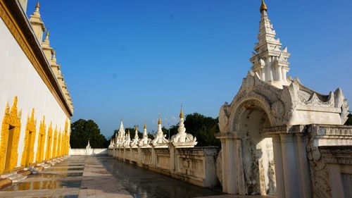 Low angle view of temple against clear blue sky