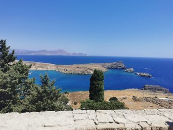 Scenic view of sea against clear blue sky