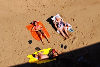High angle view of painting on sand