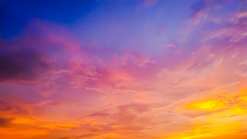 Low angle view of dramatic sky during sunset