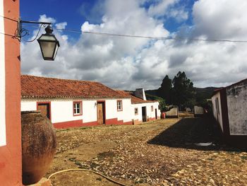 Street and buildings against sky