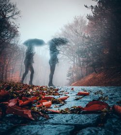 Double exposure of women standing on road