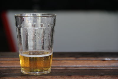 Close-up of beer glass on table