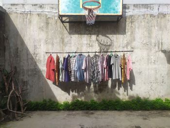 Clothes drying against wall in city