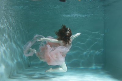 Woman swimming in sea