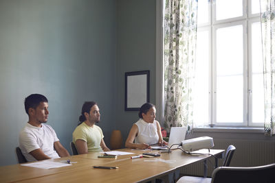 People in boardroom during business meeting