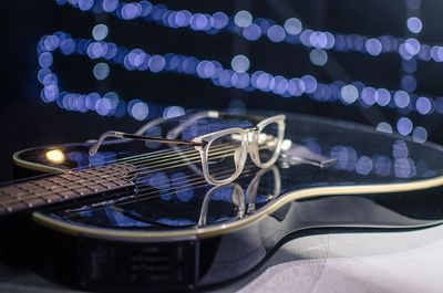 Close-up of illuminated lighting equipment on table