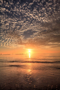 Pink and gold sunset sky over south marco island beach in florida