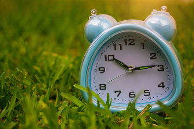 Close-up of clock on field