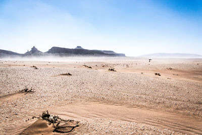 Scenic view of desert against clear sky