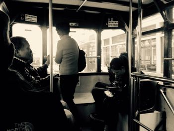 People in train at railroad station