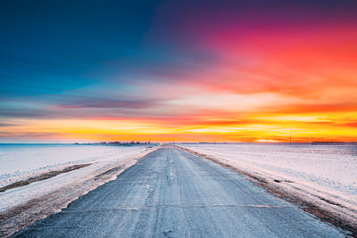 Scenic view of beach against sky during sunset