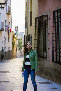 High angle view of woman standing in front of building