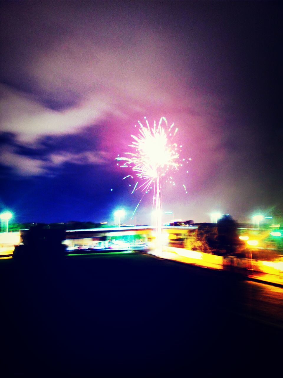 night, illuminated, firework display, glowing, long exposure, exploding, sky, motion, low angle view, celebration, firework - man made object, firework, building exterior, blurred motion, arts culture and entertainment, multi colored, built structure, light - natural phenomenon, architecture, sparks
