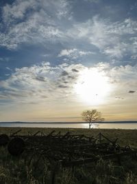 Scenic view of sea against cloudy sky