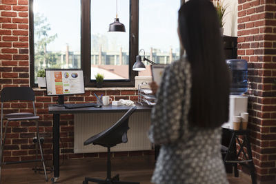 Rear view of businesswoman at office