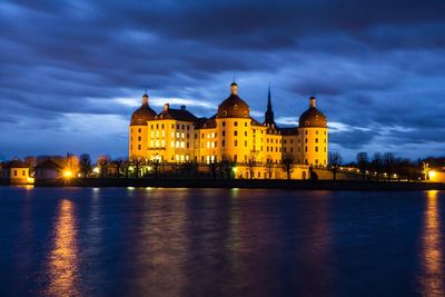 Illuminated city at waterfront