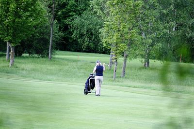 Rear view of woman on golf course