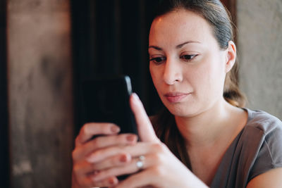 Portrait of woman using mobile phone