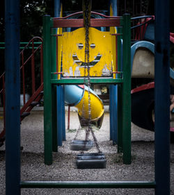 Yellow chain swing in playground