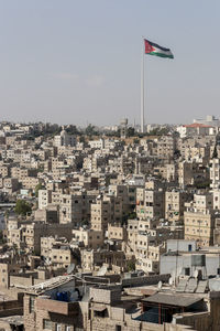 High angle view of buildings in city against clear sky