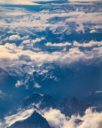 Aerial view of snowcapped mountains against sky