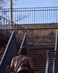 Rear view of man on stairway