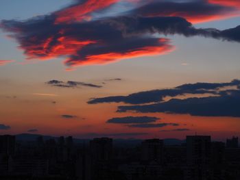 Dramatic sky over city during sunset