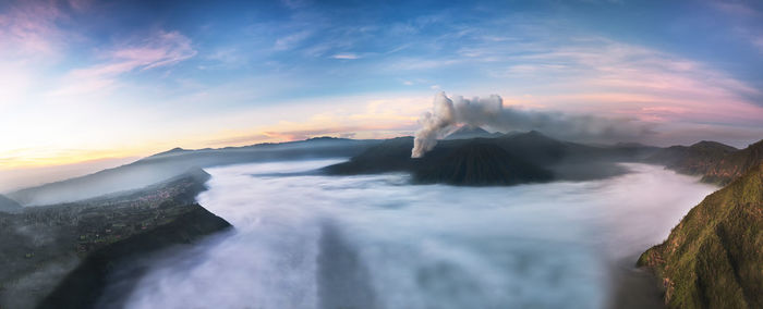 Scenic view of volcanic mt bromo against sky during sunrise