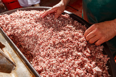 Midsection of man preparing food