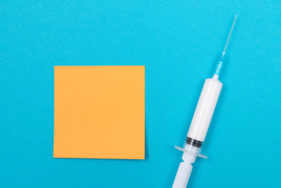Close-up of blue paint on table