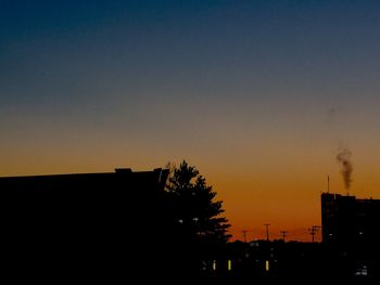 Silhouette of built structure at sunset