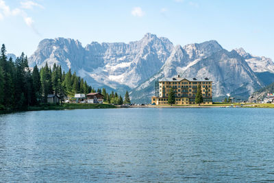 Scenic view of lake and mountains against sky