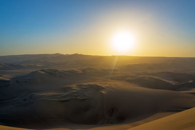 Scenic view of mountains against sky during sunset