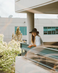 Woman standing in balcony 