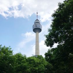 Low angle view of building against cloudy sky