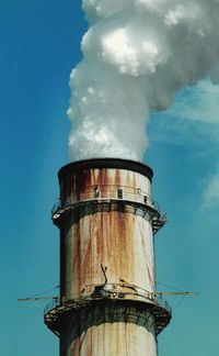 Low angle view of smoke stack against sky