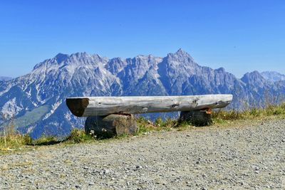 Scenic view of snowcapped mountains against clear blue sky