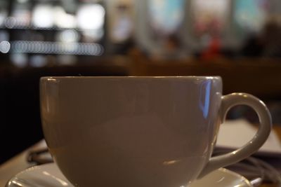 Close-up of coffee cup on table