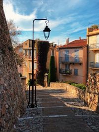 Street amidst buildings against sky